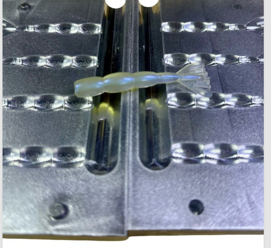 This precision-machined aluminum mold is designed for serious lure makers who want consistent results and clean bait detail. Made in the USA from high-grade 6061 aluminum, this 3-cavity mold produces 3-inch shrimp tail soft plastics ideal for inshore saltwater applications.